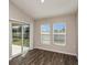 Cozy living room with hardwood floors and sliding glass door leading to the patio at 1542 Sage Ave, Haines City, FL 33844