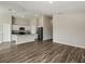 Bright living room featuring modern appliances, white cabinets, and an open floorplan at 1542 Sage Ave, Haines City, FL 33844