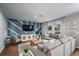 Modern living room features a stylish accent wall and backyard view at 1562 Sage Ave, Haines City, FL 33844