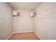 This walk-in closet provides ample storage space with built-in shelving and plenty of room for organizing at 1566 Sage Ave, Haines City, FL 33844