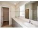 Bathroom featuring double vanity, walk-in shower, and modern finishes at 1570 Sage Ave, Haines City, FL 33844