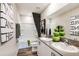 Bathroom with double vanity, modern fixtures, and tub shower combination at 1574 Sage Ave, Haines City, FL 33844