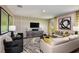 Bright living room featuring elegant decor, contemporary furniture, and hardwood floors at 1574 Sage Ave, Haines City, FL 33844