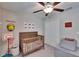 This bedroom is decorated with a playful motif and a nice ceiling fan at 1792 Yellow Trl, Lakeland, FL 33801