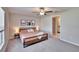 Spacious bedroom featuring a comfortable bed with soft pink bedding and neutral-colored walls at 1792 Yellow Trl, Lakeland, FL 33801