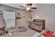 Brightly decorated bedroom with a crib, toys and a window for natural light at 1792 Yellow Trl, Lakeland, FL 33801