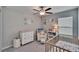 This bedroom has soft lighting and plenty of room to play and rest at 1792 Yellow Trl, Lakeland, FL 33801