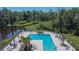 Aerial view of the community pool with lounge chairs at 1792 Yellow Trl, Lakeland, FL 33801