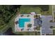 Aerial view of the community pool and clubhouse with parking lot at 1792 Yellow Trl, Lakeland, FL 33801