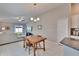 Open-concept dining area adjacent to kitchen and living room, filled with natural light at 1792 Yellow Trl, Lakeland, FL 33801