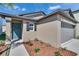 Charming single Gathering home with a teal front door and lush, manicured landscaping at 1792 Yellow Trl, Lakeland, FL 33801
