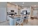 Open concept kitchen boasting granite countertops, white cabinets and stainless steel appliances at 1792 Yellow Trl, Lakeland, FL 33801