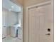 Bright laundry room with machines visible through doorway at 1792 Yellow Trl, Lakeland, FL 33801