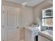 Bright laundry room with machines near a window at 1792 Yellow Trl, Lakeland, FL 33801