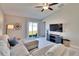 Inviting living room with a sliding glass door to backyard and a ceiling fan at 1792 Yellow Trl, Lakeland, FL 33801