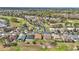 Scenic aerial view of homes in a golf course community surrounded by lush trees at 15213 Sw 14Th Avenue Rd, Ocala, FL 34473