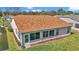 Aerial view of the backyard, roof, lawn, and patio at 15213 Sw 14Th Avenue Rd, Ocala, FL 34473