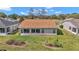 Well-maintained backyard featuring a manicured lawn, flower beds and a screen room at 15213 Sw 14Th Avenue Rd, Ocala, FL 34473