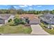 Charming single-story home with a well-manicured lawn and a long driveway at 15213 Sw 14Th Avenue Rd, Ocala, FL 34473