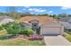 Charming single-story home with a well-manicured lawn and a two-car garage at 15213 Sw 14Th Avenue Rd, Ocala, FL 34473