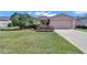 Well-maintained lawn and lush landscaping complement this charming single-Gathering home at 15213 Sw 14Th Avenue Rd, Ocala, FL 34473