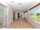 Enclosed lanai boasts tiled flooring, multiple windows, and plenty of space to relax at 15213 Sw 14Th Avenue Rd, Ocala, FL 34473