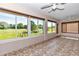 Bright lanai boasts beautiful views and tile flooring at 15213 Sw 14Th Avenue Rd, Ocala, FL 34473