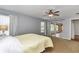 Comfortable main bedroom with ceiling fan and sliding doors to the lanai at 15213 Sw 14Th Avenue Rd, Ocala, FL 34473