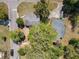 Aerial view showcasing the property's layout, landscaping, and proximity to nearby streets and homes at 218 W Magnolia St, Clermont, FL 34711