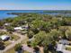 Panoramic aerial view of a neighborhood with lush greenery and waterfront views, offering a serene and picturesque setting at 218 W Magnolia St, Clermont, FL 34711