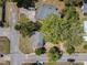 Aerial view showcasing the property's layout, landscaping, and proximity to nearby streets and homes at 218 W Magnolia St, Clermont, FL 34711