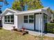 Charming home featuring a manicured lawn and inviting entryway at 218 W Magnolia St, Clermont, FL 34711