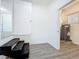 Utility Room with water heater and gray wood-look floors at 218 W Magnolia St, Clermont, FL 34711