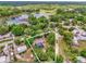 An aerial view showcases the home and large surroundings including a body of water at 31632 Spruce Dr, Eustis, FL 32736