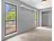 Bedroom with two large windows and a walk-in closet at 31632 Spruce Dr, Eustis, FL 32736