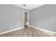 Bedroom with tiled flooring, white trim, gray walls, and closet at 31632 Spruce Dr, Eustis, FL 32736
