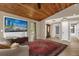 Warm living room features tile floors, neutral walls, and a large area rug at 31632 Spruce Dr, Eustis, FL 32736