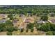 A bird's eye view of a property featuring landscaping, a long drive, and room to park recreational vehicles at 32421 Wolfs Trl, Sorrento, FL 32776