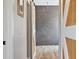 Modern bathroom with barn doors to the main bedroom, and a tiled shower, blending style and functionality at 32421 Wolfs Trl, Sorrento, FL 32776