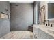 Modern bathroom featuring a spacious shower, a sleek dual-sink vanity, and stylish fixtures at 32421 Wolfs Trl, Sorrento, FL 32776