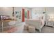 Charming bedroom featuring a comfortable bed, modern desk, and stylish decor at 32421 Wolfs Trl, Sorrento, FL 32776