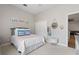 Inviting bedroom featuring closet, bed, and stylish decor at 32421 Wolfs Trl, Sorrento, FL 32776