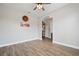 Bright dining room with wood-look tile flooring and neutral walls at 32421 Wolfs Trl, Sorrento, FL 32776