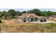 Charming single-story home featuring a well-manicured front yard and inviting curb appeal at 32421 Wolfs Trl, Sorrento, FL 32776