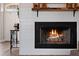 Cozy living room fireplace with white shiplap surround and rustic wooden mantel at 32421 Wolfs Trl, Sorrento, FL 32776