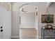 Bright foyer with tile flooring, arched doorway, and views into the living spaces at 32421 Wolfs Trl, Sorrento, FL 32776