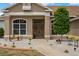 Close up of the front exterior, with a landscaped walkway and stone accents at 32421 Wolfs Trl, Sorrento, FL 32776