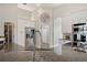 Kitchen with stainless steel appliances, white cabinets, and decorative hardware at 32421 Wolfs Trl, Sorrento, FL 32776