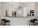 Bright kitchen boasts granite countertops, stainless appliances, and white cabinetry at 32421 Wolfs Trl, Sorrento, FL 32776