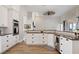 Spacious kitchen with stainless appliances, granite counters, and open floor plan at 32421 Wolfs Trl, Sorrento, FL 32776